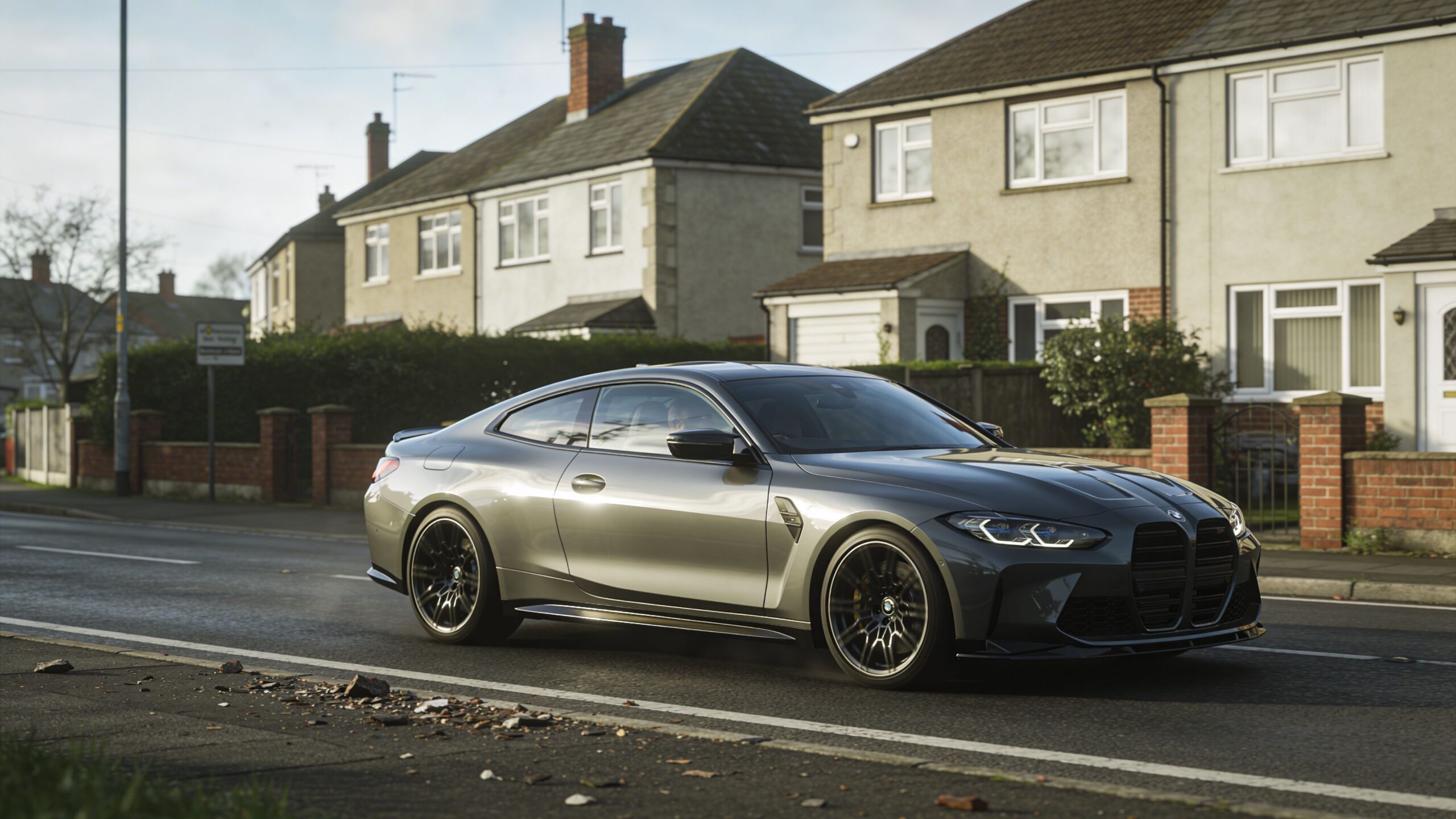 Expert Paint Protection Film Installation in Whitby 2 A modern grey BMW coupe driving on a suburban road in front of brick residential houses.