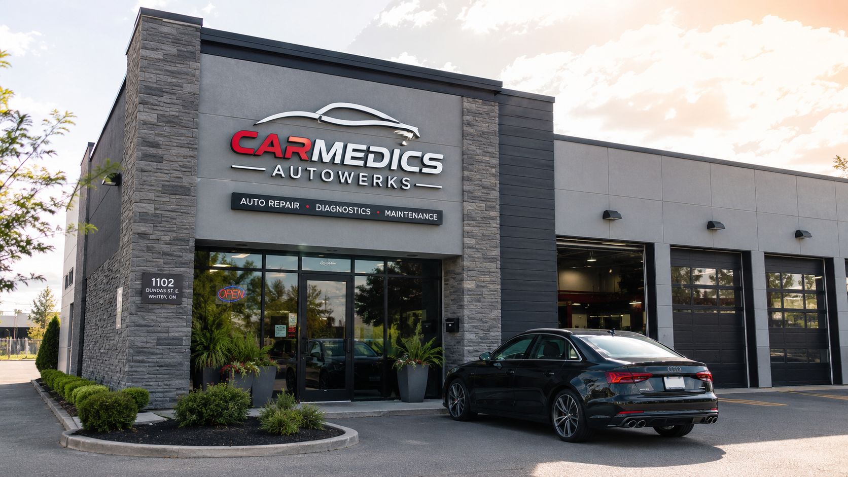 Car Wiper Near Me: A Whitby Driver's Guide for 2026 4 A modern auto repair shop named Car Medics Autowerks with a black sedan parked in the front.